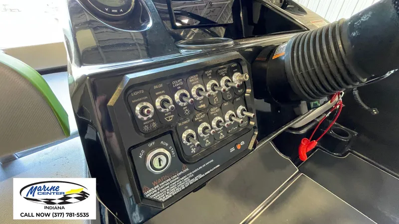 Slide: The Image of Control panel of a 2019 Heyday WT-1 boat with various switches and ignition. - 2