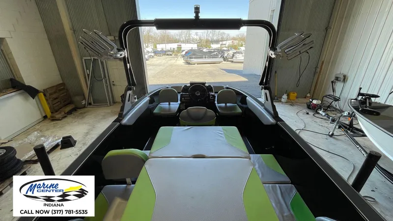 Slide: The Image of 2019 Heyday WT-1 boat interior with green and gray seating, displayed at Marine Center Indiana. - 6