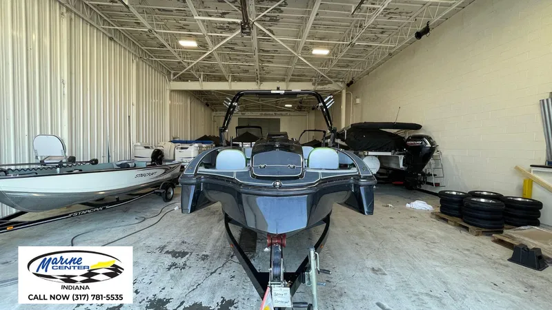 Slide: The Image of 2019 Heyday WT-1 boat in a storage facility, Marine Center Indiana sign visible. - 9