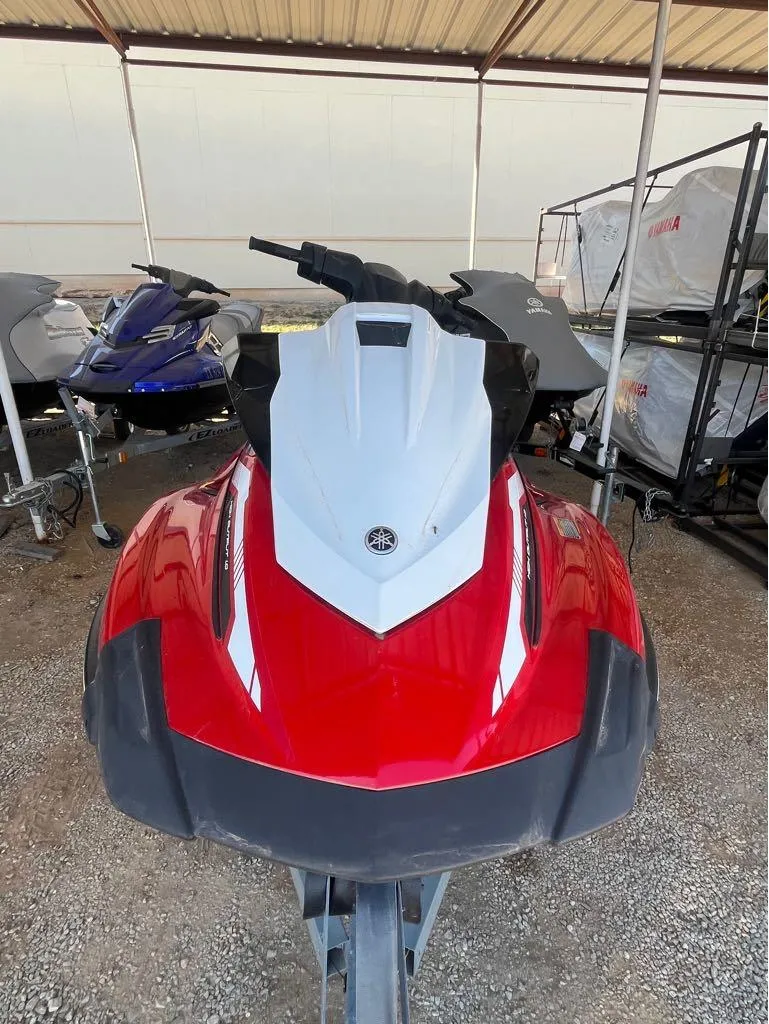 Slide: The Image of 2018 Yamaha VX Cruiser jet ski in red and white, parked under a shelter. - 3
