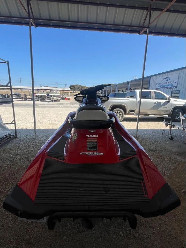 Slide: The Image of 2018 Yamaha VX Cruiser jet ski in a covered outdoor area. - 4