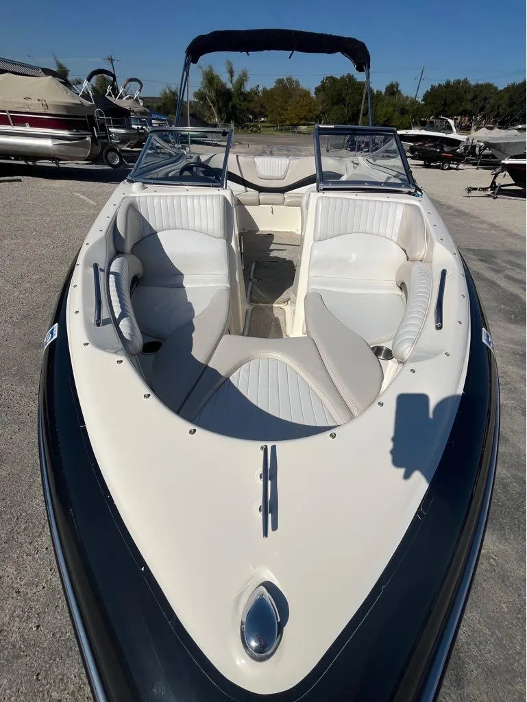 Slide: The Image of 2007 Glastron GXL235 boat with white seating and open bow design. - 4