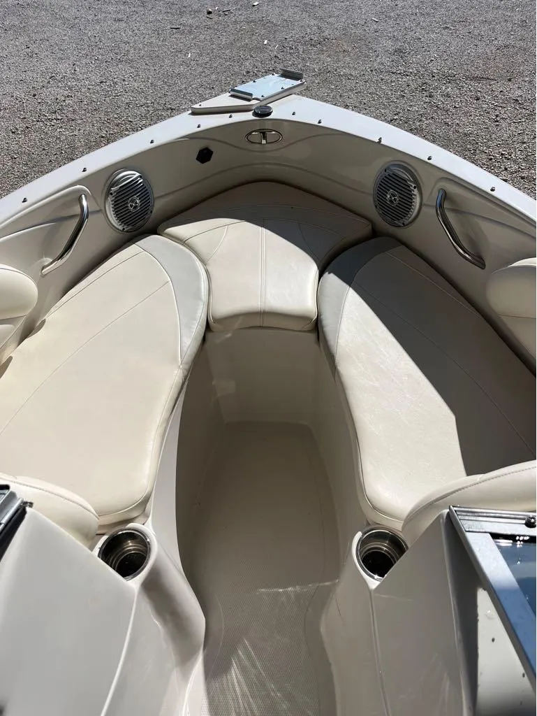 Slide: The Image of 2009 Tahoe Q71SSF boat interior with white seating and cup holders. - 5
