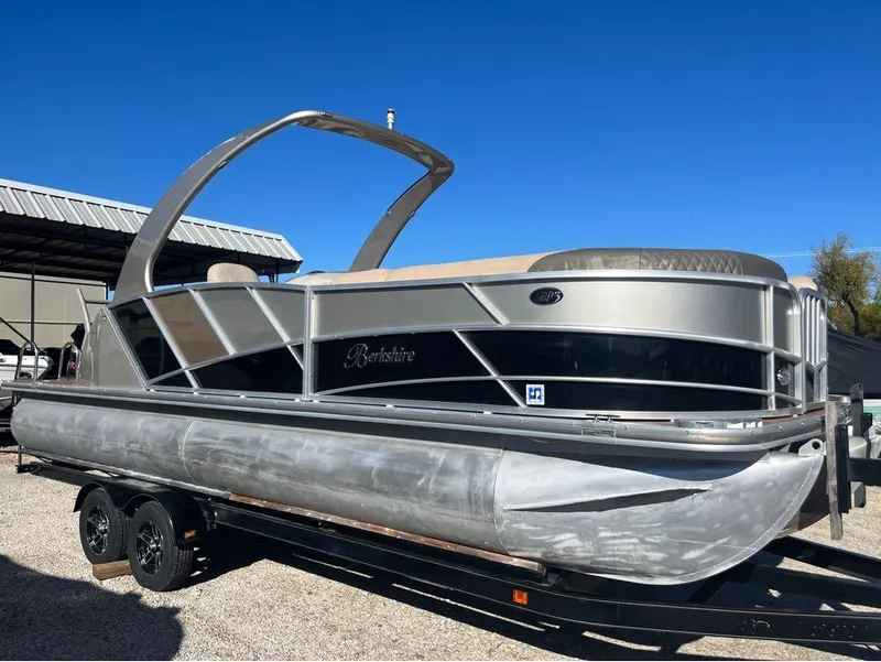 Slide: The Image of 2013 Berkshire 250 Sport BP3 pontoon boat on trailer under clear blue sky. - 8