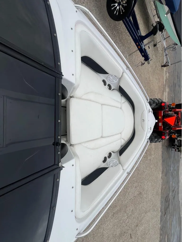 Slide: The Image of 2007 Crownline 23 SS LPX boat interior with white seating and cup holders. - 5