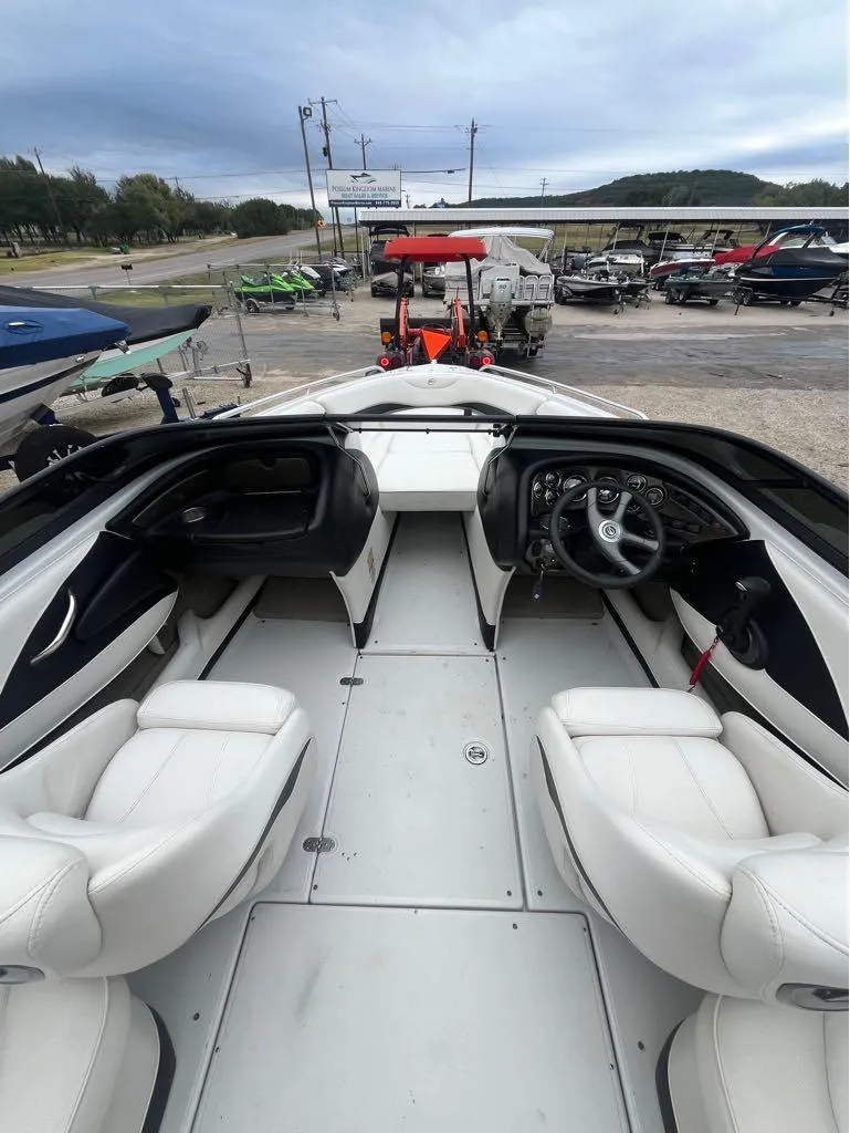 Slide: The Image of 2007 Crownline 23 SS LPX boat interior with white seating and steering wheel. - 6