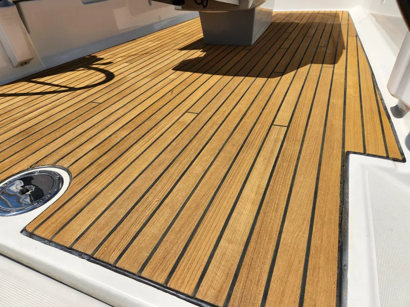 Slide: The Image of Teak deck of 2013 Beneteau Oceanis 41 sailboat, showcasing elegant wood finish. - 22
