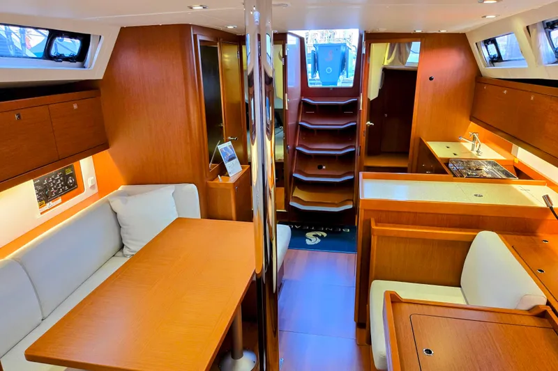 Slide: The Image of Interior of 2013 Beneteau Oceanis 41 sailboat with wood finish and modern amenities. - 32