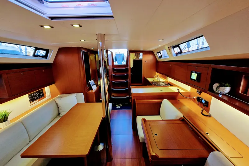 Slide: The Image of Interior of 2013 Beneteau Oceanis 41 yacht, featuring elegant wood finishes and modern amenities. - 33