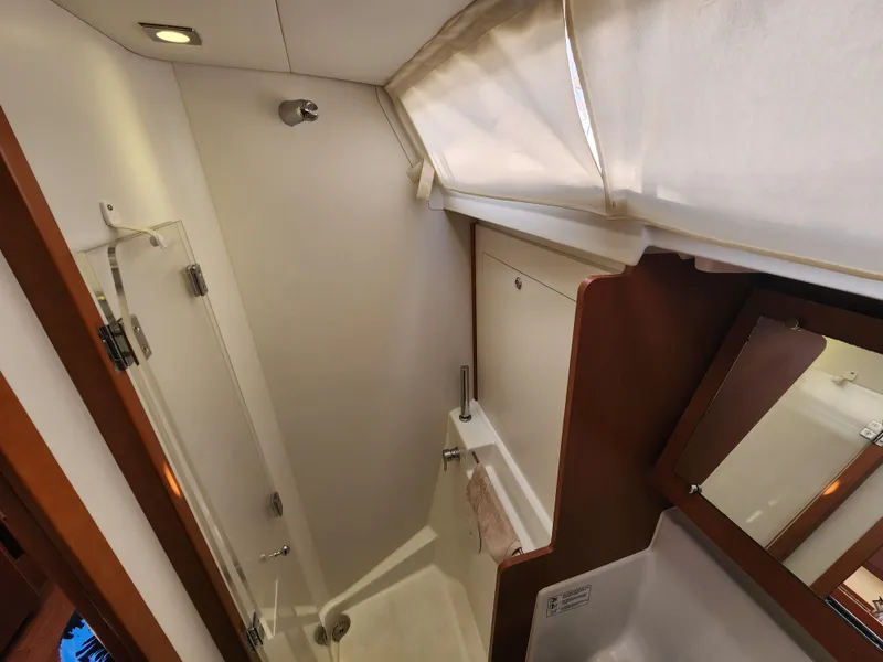 Slide: The Image of Beneteau Oceanis 41 bathroom interior, 2013 model, featuring shower and mirror. - 43