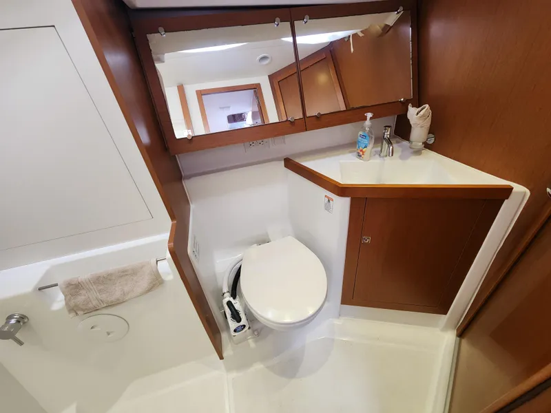 Slide: The Image of Bathroom interior of 2013 Beneteau Oceanis 41 yacht with wooden cabinetry and modern fixtures. - 44