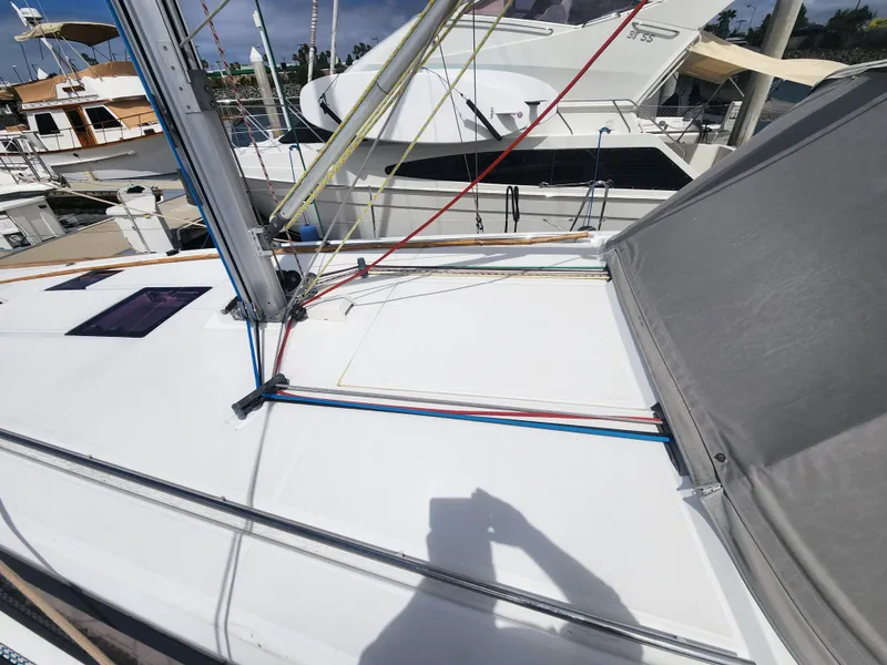 Slide: The Image of 2013 Beneteau Oceanis 41 sailboat deck with rigging and marina background. - 6