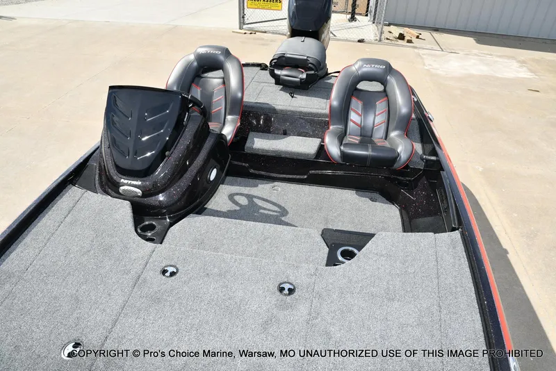 Slide: The Image of 2018 Nitro Z18 Pro boat interior with dual seats and carpeted deck. - 11