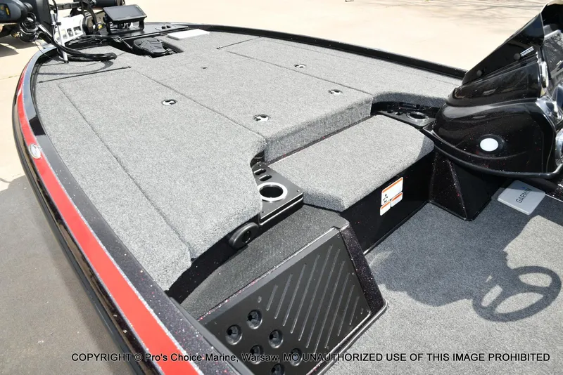 Slide: The Image of 2018 Nitro Z18 Pro boat deck with gray carpet and storage compartments. - 12