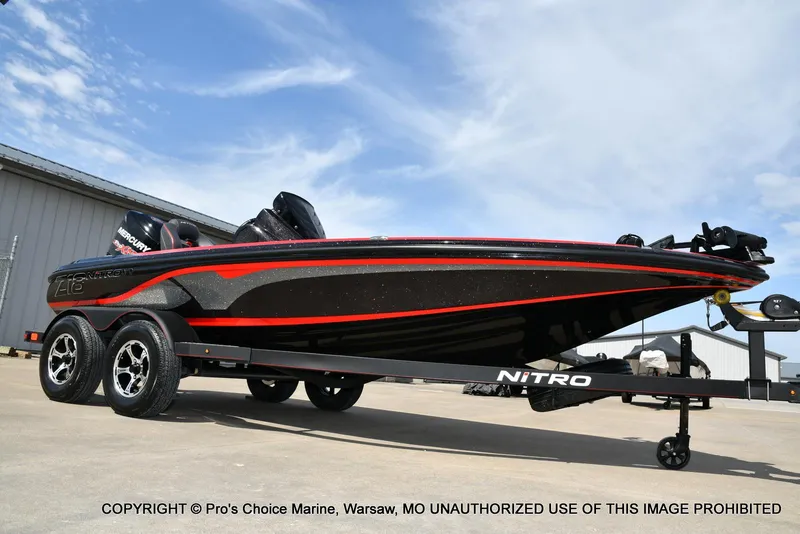 Slide: The Image of 2018 Nitro Z18 Pro boat with 175 Pro-XS engine on trailer, outdoor setting. - 16