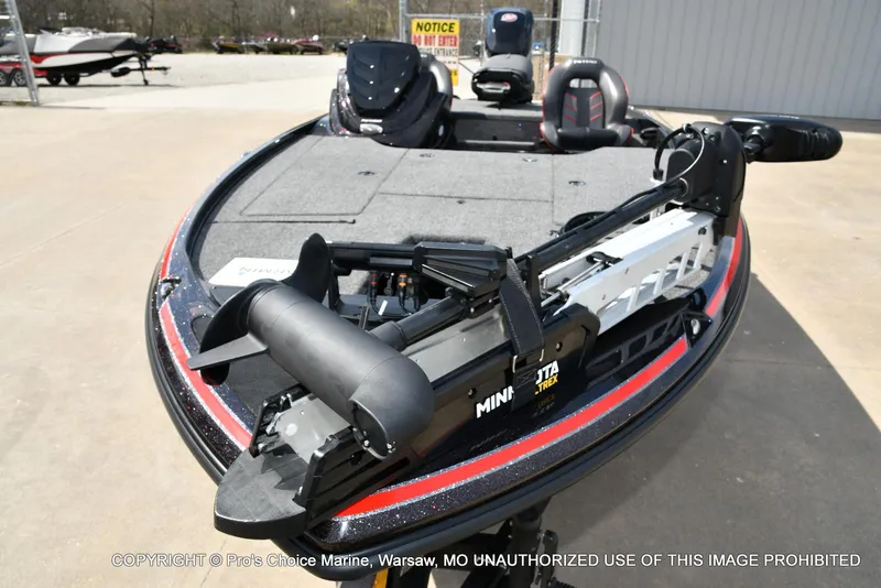 Slide: The Image of 2018 Nitro Z18 Pro boat with Minn Kota trolling motor, parked outdoors. - 31