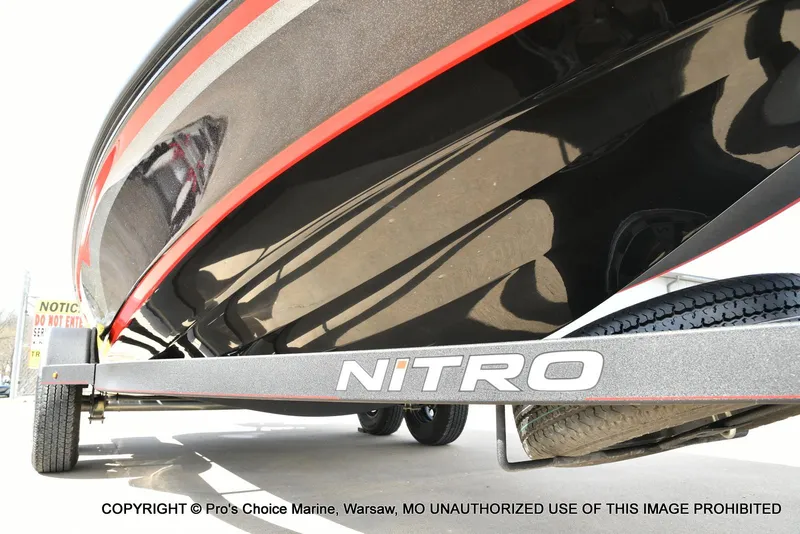 Slide: The Image of 2018 Nitro Z18 Pro boat on trailer, close-up view with red accents. - 33