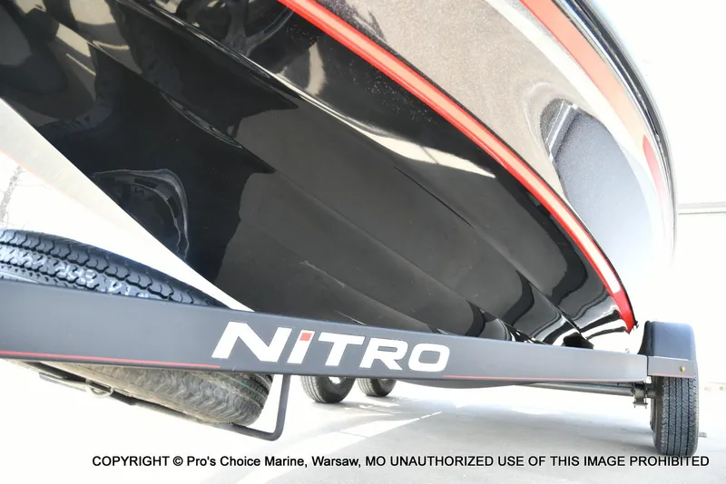 Slide: The Image of 2018 Nitro Z18 Pro boat on trailer, close-up view of hull and branding. - 34