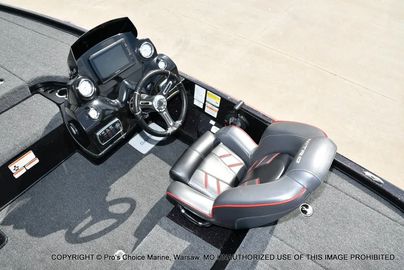 Slide: The Image of 2018 Nitro Z18 Pro boat interior with steering console and cushioned seat. - 43