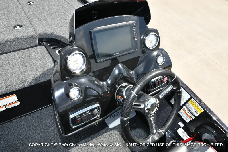 Slide: The Image of 2018 Nitro Z18 Pro boat dashboard with steering wheel and gauges. - 44