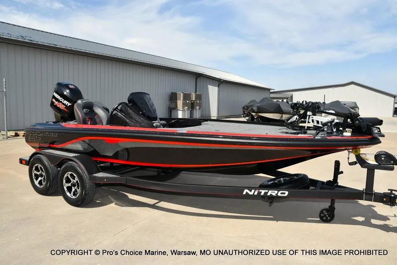 Slide: The Image of 2018 Nitro Z18 Pro boat with 175 Pro-XS engine on trailer, parked outdoors. - 72