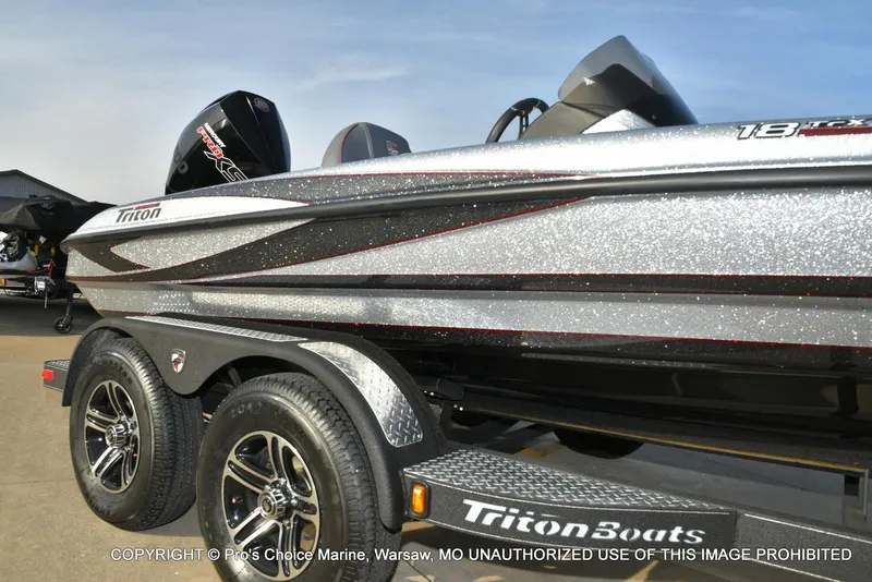 Slide: The Image of 2024 Triton 18 TRX boat with 200 Pro-XS engine on trailer, side view. - 12
