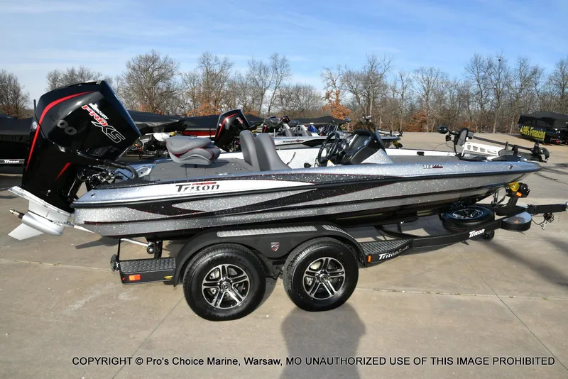 Slide: The Image of 2024 Triton 18 TRX boat with 200 Pro-XS engine on a trailer. - 15