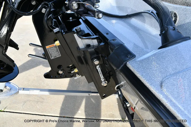 Slide: The Image of 2024 Triton 18 TRX boat motor mount detail with hydraulic components. - 17