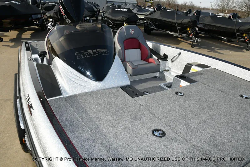 Slide: The Image of 2024 Triton 18 TRX boat with 200 Pro-XS engine, featuring spacious deck and seating. - 27