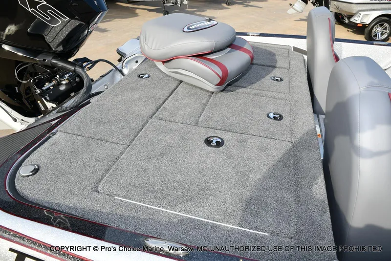 Slide: The Image of 2024 Triton 18 TRX boat deck with gray carpet and seating. - 28