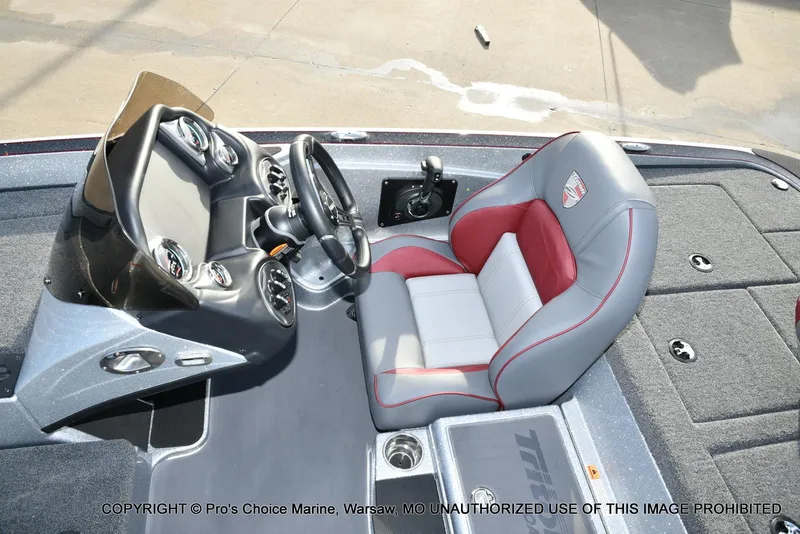 Slide: The Image of 2024 Triton 18 TRX w/200 Pro-XS boat interior with steering console and cushioned seat. - 33