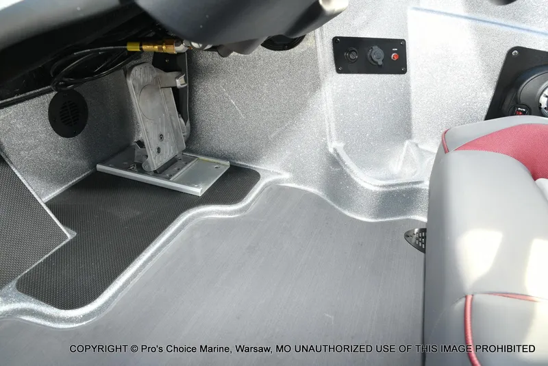 Slide: The Image of Interior view of 2024 Triton 18 TRX boat, featuring foot pedal and control panel. - 34
