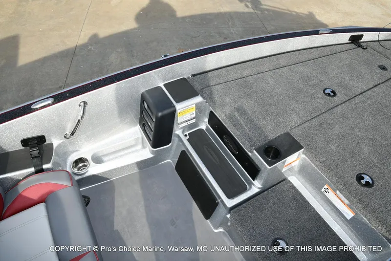 Slide: The Image of 2024 Triton 18 TRX boat interior with seating and storage compartments. - 36