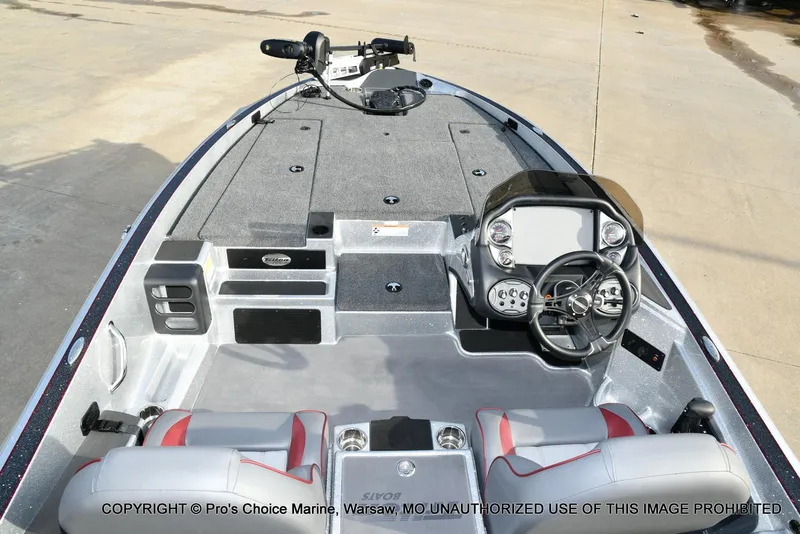 Slide: The Image of 2024 Triton 18 TRX boat interior with steering console and seating. - 4