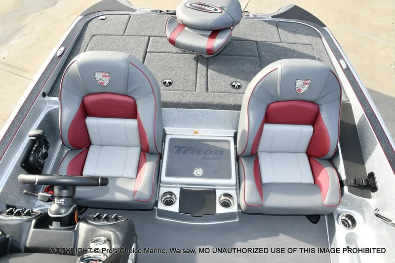 Slide: The Image of 2024 Triton 18 TRX boat interior with dual seats and steering console. - 41