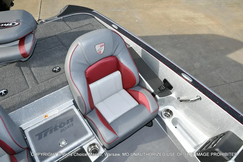 Slide: The Image of 2024 Triton 18 TRX boat interior with gray and red seating. - 43