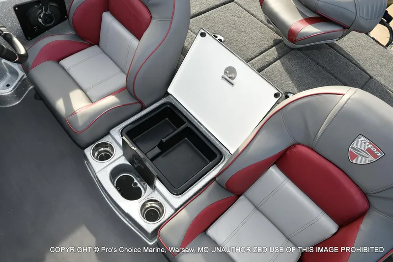 Slide: The Image of 2024 Triton 18 TRX boat interior with gray and red seats, storage compartment, and cup holders. - 44