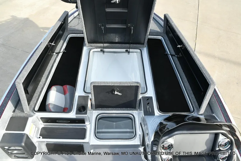 Slide: The Image of 2024 Triton 18 TRX boat interior with open storage compartments and seating. - 45