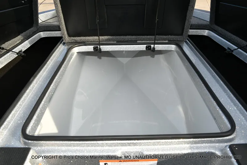 Slide: The Image of Open storage compartment of 2024 Triton 18 TRX w/200 Pro-XS boat. - 48