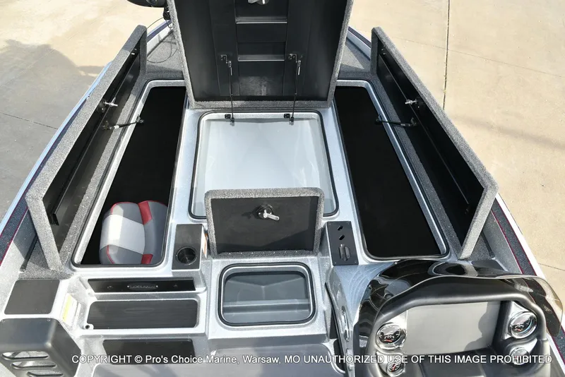 Slide: The Image of 2024 Triton 18 TRX boat interior with storage compartments and seating. - 5