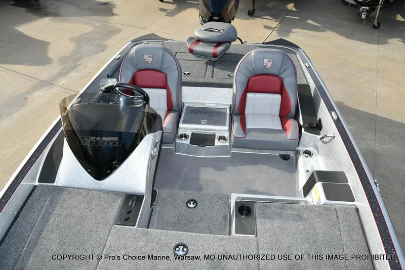 Slide: The Image of 2024 Triton 18 TRX w/200 Pro-XS boat interior with dual seats and steering console. - 6