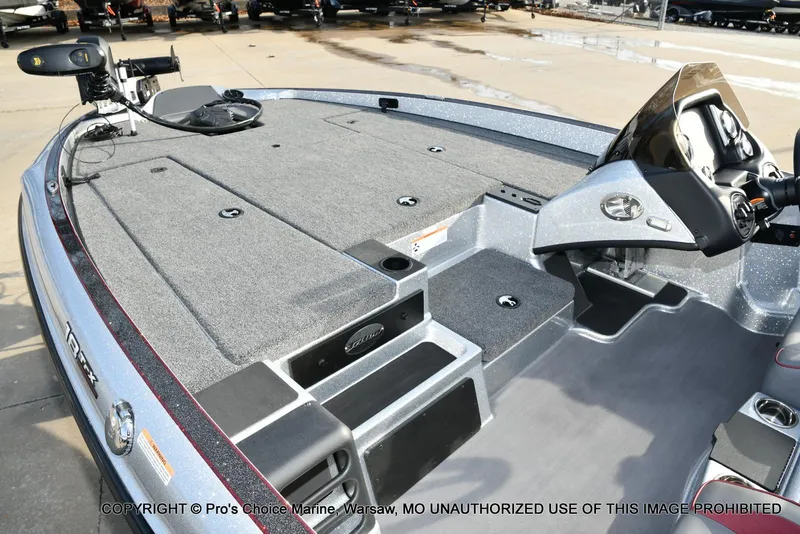 Slide: The Image of 2024 Triton 18 TRX boat interior with advanced controls and spacious deck. - 9
