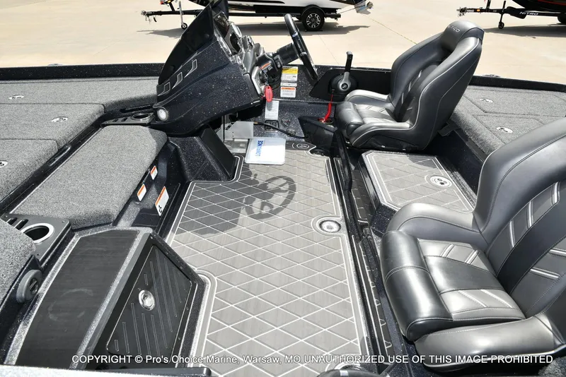 Slide: The Image of 2022 Nitro Z21 XL Pro boat interior with sleek seating and modern dashboard design. - 12