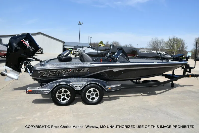 Slide: The Image of 2022 Nitro Z21 XL Pro boat on trailer, parked outdoors. - 19