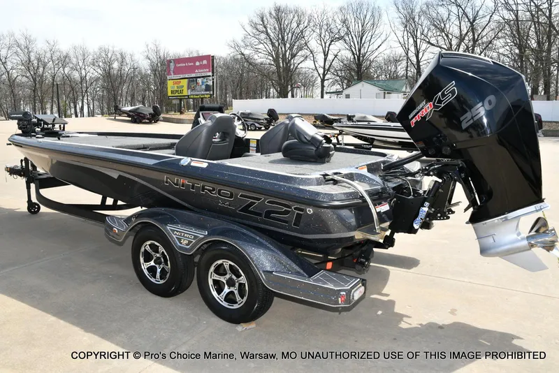 Slide: The Image of 2022 Nitro Z21 XL Pro boat with powerful engine, parked on concrete surface. - 27