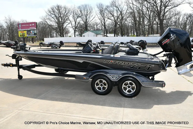 Slide: The Image of 2022 Nitro Z21 XL Pro boat on trailer, parked outdoors. - 28