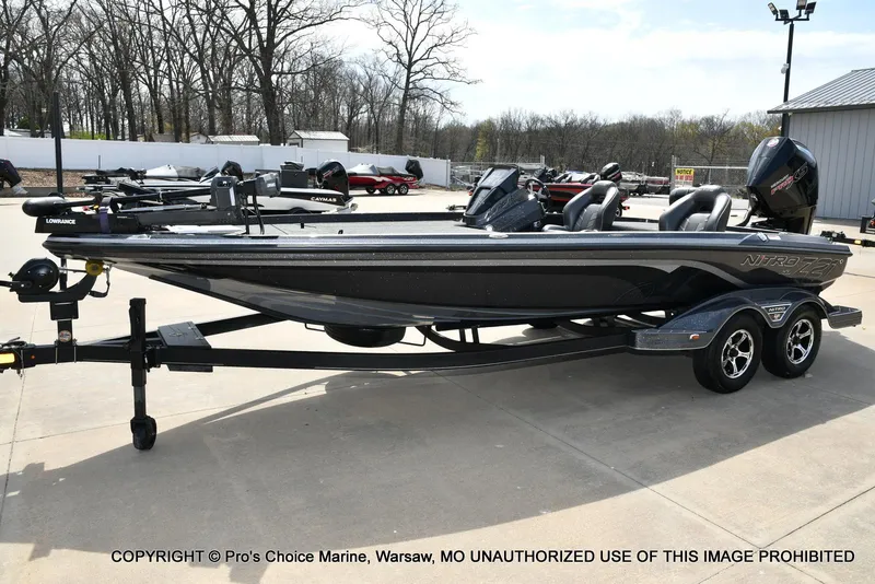 Slide: The Image of 2022 Nitro Z21 XL Pro boat on trailer, parked outdoors, featuring sleek design and modern equipment. - 29
