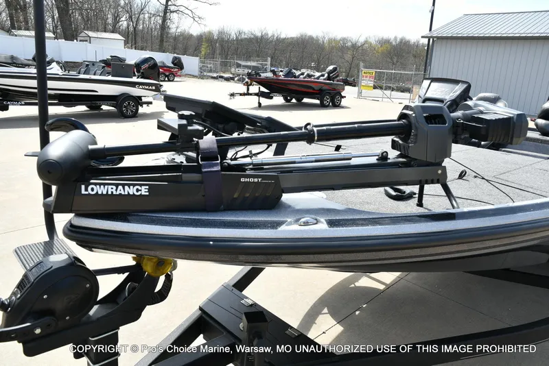 Slide: The Image of 2022 Nitro Z21 XL Pro boat with Lowrance Ghost trolling motor in a marina setting. - 31
