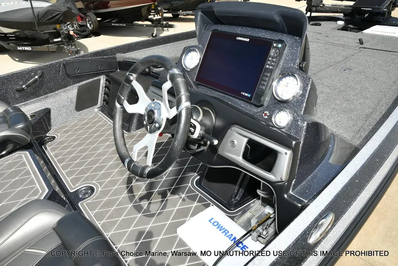 Slide: The Image of 2022 Nitro Z21 XL Pro boat interior with steering wheel and Lowrance display. - 6