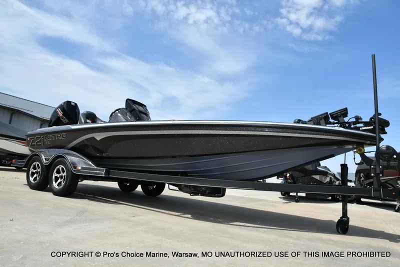 Slide: The Image of 2022 Nitro Z21 XL Pro boat on trailer under blue sky. - 79